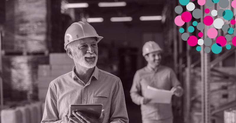 men at a building site with hard hat on